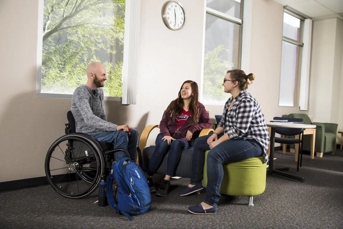 3 students talking to each other